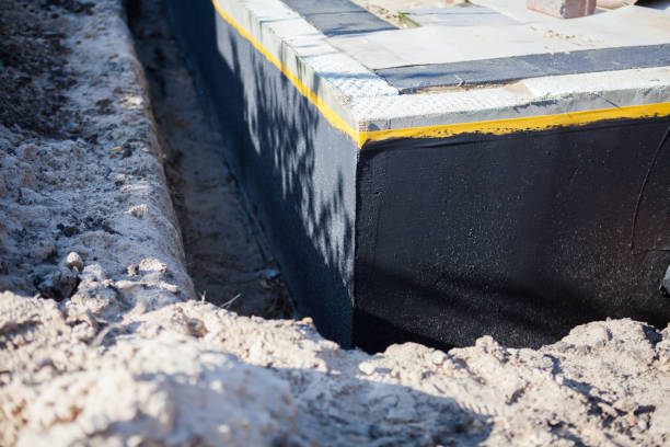 Professional Waterproofing technician working in Falls Church, VA